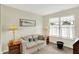 This living room features a comfortable sofa, and plenty of natural light from the window at 8038 Sydney Ln, Avon, IN 46123