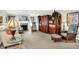 Cozy living room featuring a fireplace, ample seating, and built-in shelving at 8038 Sydney Ln, Avon, IN 46123