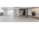 Spacious unfinished basement with concrete flooring, a staircase, support beams, and multiple doorways at 8117 Scarborough Ct, Indianapolis, IN 46256