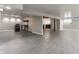 A spacious basement featuring modern gray flooring and stylish kitchenette at 8117 Scarborough Ct, Indianapolis, IN 46256