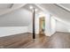 Finished bonus room featuring wood-look flooring, a support beam and painted in white at 8117 Scarborough Ct, Indianapolis, IN 46256