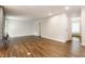 Spacious living room with stylish floors and neutral walls, perfect for relaxation or entertainment at 8117 Scarborough Ct, Indianapolis, IN 46256