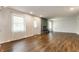 Open concept living room boasts a modern fireplace, neutral decor, and wood-look flooring at 8117 Scarborough Ct, Indianapolis, IN 46256