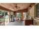 The kitchen includes a ceiling fan, stainless steel refrigerator, kitchen sink, and plenty of natural light at 8217 S Talbott Ave, Indianapolis, IN 46227