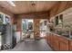The kitchen includes a stainless steel refrigerator, kitchen sink, and a kitchen island at 8217 S Talbott Ave, Indianapolis, IN 46227