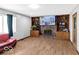 Cozy living room with a brick fireplace, built-in shelving, and modern flooring, perfect for relaxation and entertainment at 8217 S Talbott Ave, Indianapolis, IN 46227