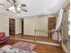 Multi-level living room featuring hardwood floors, bright windows and neutral paint, perfect for relaxation and entertainment at 8217 S Talbott Ave, Indianapolis, IN 46227