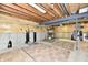 Unfinished basement space with exposed beams, flooring, and laundry area at 8460 Brittany N Ct, Indianapolis, IN 46236