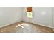 This small bedroom is carpeted and features a window with blinds, neutral paint, and light fixtures at 8460 Brittany N Ct, Indianapolis, IN 46236