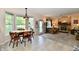 The space features a mix of dining and living areas with neutral tones, tile, hardwood, and carpeted floors at 8460 Brittany N Ct, Indianapolis, IN 46236