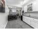 The finished basement has a stylish bar area and plenty of space for seating, ideal for entertaining guests at 8864 S Tibbs Ave, Indianapolis, IN 46217