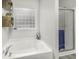 This bathroom has a luxurious soaking tub and a separate shower, offering a spa-like experience at 8864 S Tibbs Ave, Indianapolis, IN 46217