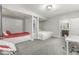 Inviting bedroom boasts custom built-in beds, with access to an ensuite bathroom and functional desk space at 8864 S Tibbs Ave, Indianapolis, IN 46217