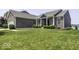 Lovely brick home boasting lush green lawn, inviting facade, and ample space for comfortable suburban living at 8864 S Tibbs Ave, Indianapolis, IN 46217