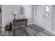 Bright foyer featuring stylish wood-look flooring, a classic console table, and an inviting entryway at 8864 S Tibbs Ave, Indianapolis, IN 46217