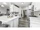 Contemporary kitchen featuring white cabinets, stainless steel appliances, and a center island at 8864 S Tibbs Ave, Indianapolis, IN 46217