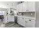 Bright kitchen with white cabinetry, stainless steel appliances, and ample counter space at 8864 S Tibbs Ave, Indianapolis, IN 46217