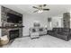 Comfortable living room showcasing a stone fireplace, neutral decor, and ample seating for Gathering gatherings at 8864 S Tibbs Ave, Indianapolis, IN 46217