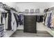 Well-organized walk-in closet with ample hanging space and built-in storage for clothes and accessories at 8864 S Tibbs Ave, Indianapolis, IN 46217