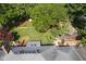 Aerial shot of a backyard featuring a deck, yard with lush greenery and mature trees at 9420 N Kenwood Ave, Indianapolis, IN 46260