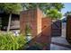 View of the backyard featuring a brick fence and landscaped garden area at 9420 N Kenwood Ave, Indianapolis, IN 46260