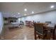 A spacious basement with a ping pong table, tables and chairs at 9420 N Kenwood Ave, Indianapolis, IN 46260