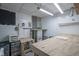 Finished basement area featuring custom workbench with pegboard and storage at 9420 N Kenwood Ave, Indianapolis, IN 46260