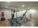 Finished basement area featuring home gym equipment at 9420 N Kenwood Ave, Indianapolis, IN 46260