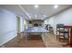 Finished basement with recreation area, complete with ping pong table and bar stools at 9420 N Kenwood Ave, Indianapolis, IN 46260