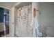 Tiled bathroom featuring a shower with curtain, white tiled walls, and view to hallway at 9420 N Kenwood Ave, Indianapolis, IN 46260