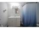 Clean bathroom featuring vanity with sink, storage and shower tub with curtain at 9420 N Kenwood Ave, Indianapolis, IN 46260