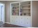 Built-in shelving and cabinets in the home with decorative items and books for an organized look at 9420 N Kenwood Ave, Indianapolis, IN 46260