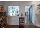 Charming dining area with a view to the kitchen and sliding barn doors to another room at 9420 N Kenwood Ave, Indianapolis, IN 46260