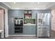 Bright kitchen with stainless steel refrigerator, microwave, oven and plenty of cabinet storage at 9420 N Kenwood Ave, Indianapolis, IN 46260