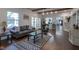 Cozy living room with exposed wood beams, a brick fireplace, and an open layout for easy flow at 9420 N Kenwood Ave, Indianapolis, IN 46260