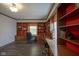 Home office features built-in shelving and dual work stations with ample storage and wood floors at 9420 N Kenwood Ave, Indianapolis, IN 46260