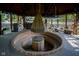 Outdoor entertaining space with custom fire pit and vintage decor at 9420 N Kenwood Ave, Indianapolis, IN 46260