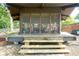 View of the charming outdoor structure with screen panels and wood deck at 9420 N Kenwood Ave, Indianapolis, IN 46260