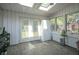 Bright sun room with skylights, white brick walls and large windows offering ample natural light at 9420 N Kenwood Ave, Indianapolis, IN 46260