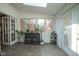 Sun room featuring bright light, large windows and an assortment of cacti and plants at 9420 N Kenwood Ave, Indianapolis, IN 46260