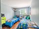 Playful bedroom with twin beds, colorful bedding, and playful decor creating a cozy space at 10622 Penn Dr, Indianapolis, IN 46280