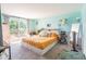 Cozy bedroom with a comfortable bed, walk out to a private balcony, and natural light at 10622 Penn Dr, Indianapolis, IN 46280