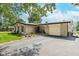 Home exterior view showcases a brick facade, attached garage, and well-kept landscaping at 10622 Penn Dr, Indianapolis, IN 46280