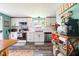 Bright kitchen with white cabinetry, subway tile backsplash, and modern appliances at 10622 Penn Dr, Indianapolis, IN 46280