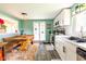 Inviting kitchen featuring white cabinets, a dining nook, and modern appliances at 10622 Penn Dr, Indianapolis, IN 46280