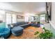 Bright living room with a large sectional sofa, area rug, and an open view to the kitchen at 10622 Penn Dr, Indianapolis, IN 46280
