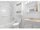 Clean and functional bathroom with a tub, shower, and ample storage space at 10928 W Jackson St, Muncie, IN 47304