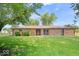 Charming brick home with mature trees and a well-manicured lawn at 10928 W Jackson St, Muncie, IN 47304