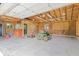 Interior of garage with lawnmower and tools at 10928 W Jackson St, Muncie, IN 47304