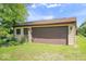 Exterior shot of detached one-car garage with lawn at 10928 W Jackson St, Muncie, IN 47304
